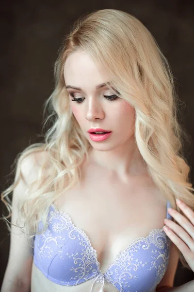 Portrait of young beautiful blonde sexy woman wearing a bra. Close up retouched portrait. — Stock Photo, Image