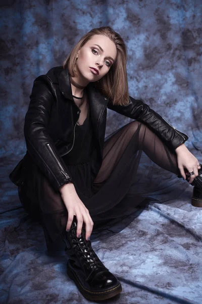 High fashion look, glamor stylish beautiful young woman model with red lips in hipster rock black cloth in boots. Retouched shot — Stock Photo, Image