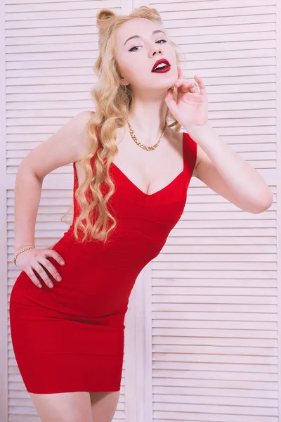 Vintage pinup style. Blonde stylish young woman Attractive girl wearing retro red dress. Studio shot. — Stock Photo, Image