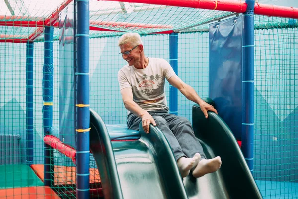 Senior Man Having Fun Birthday Party Kids Amusement Park Indoor — Stock Photo, Image