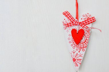 Red and white handmade hearts on white background. Copy space.