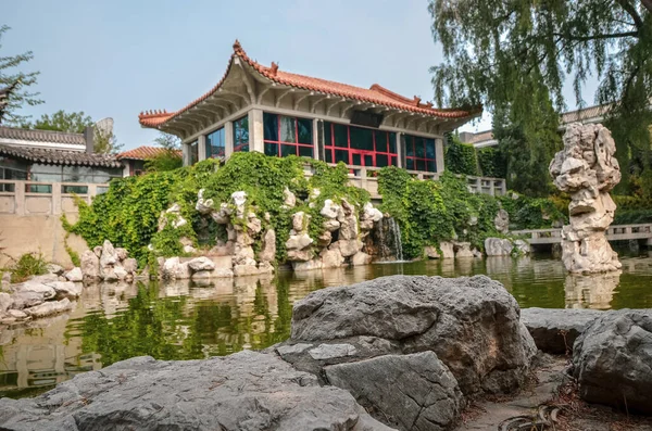 Cozy chinese garden with a pond and pavillion.