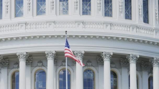 Close up of the stars and stripes flag on the capitol building, Washington DC. — Stock video