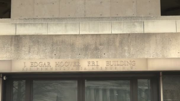 An engraving above the entrance to the fbi building in washington — Stock Video