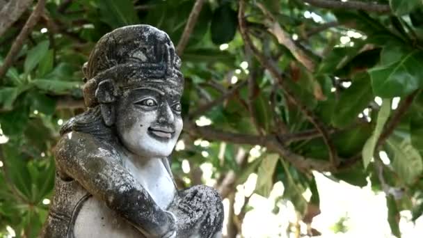 KUTA, INDONESIA - JUNE, 15, 2017: close up of a stone statue at kuta beach — Stock Video