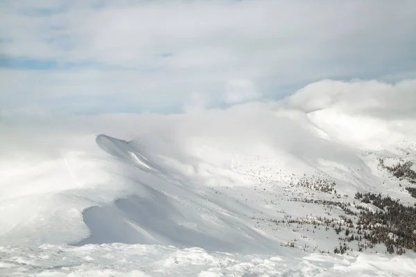 View on the mountains peaks covered with snow. Snowy mountains landscape