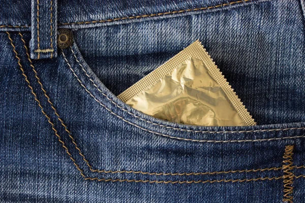 Condom in jeans pocket — Stock Photo, Image