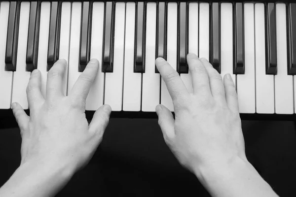 Close up of woman hands playing piano — Stock Photo, Image