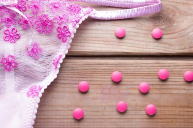 contraceptive pill and pink lingirie clipart