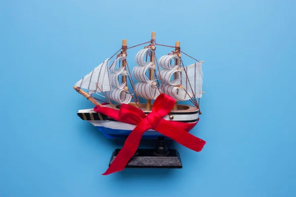 ship model with red bow