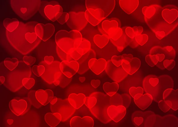 Векторний фон боке червоного серця, абстрактний святковий фон — стоковий вектор