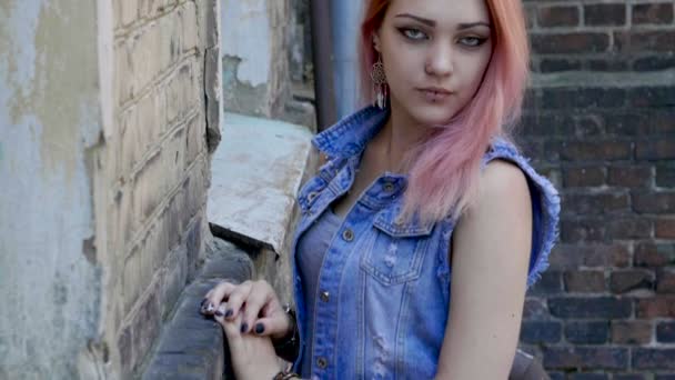 Teenage Girl With Nose And Lips Piercing And Pink Hair Standing On
