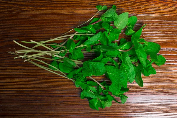 Peppermint in wood background — Stock Photo, Image