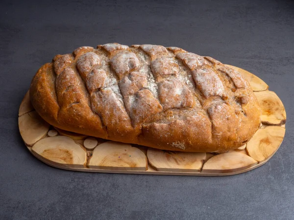 Freshly baked bread on paper zero waste bags, brown whole fresh bread — Stock Photo, Image