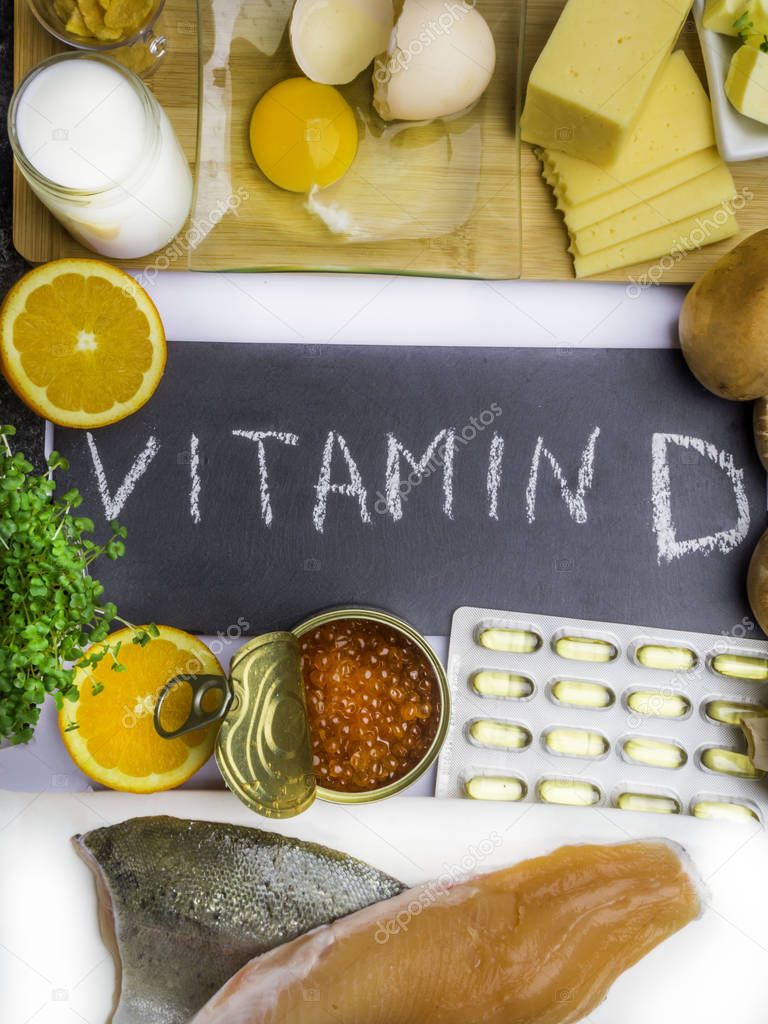 Vitamin D in food as fish, caviar, orange, micro greens, cheese, eggs, mushrooms, milk, butter, corn, oil, products rich in vitamin D.