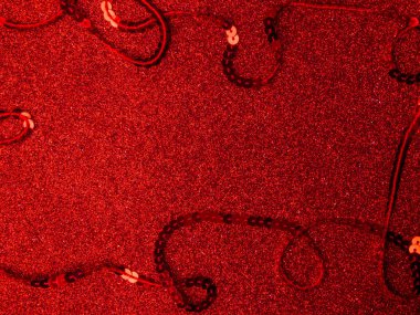 red background for a festive decoration, red glitter texture for festive poster, love concept for valentines day with sweet and romantic moment, christmas, weeding postcard