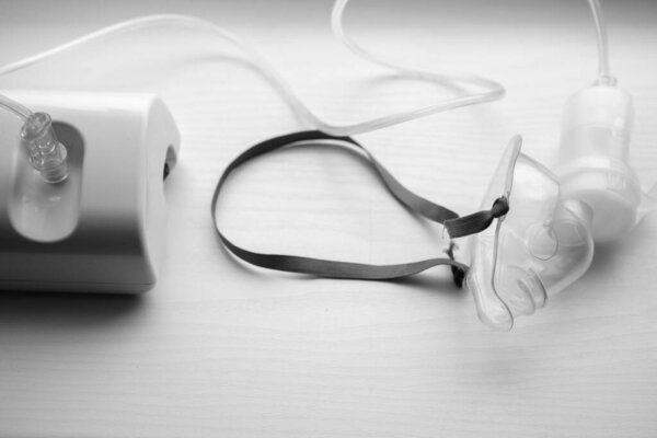 Ultrasonic inhaler or nebulizer on white background. Respiratory medicine. Asthma breathing treatment with oxygen mask, medical equipment for inhalation, respiratory mask for bronchitis health