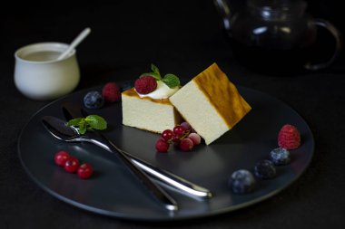 Appetizing cottage cheese with berries on the plate