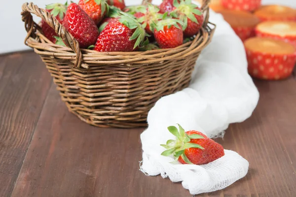 Basket of strawberry on wooden table — Stock Photo, Image