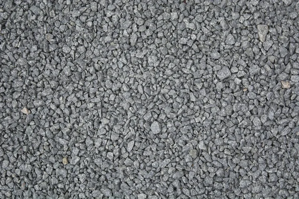 Grey small gravel textured road background