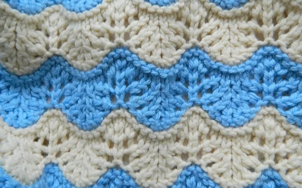 Knitted pattern spokes "Waves" Stock Image