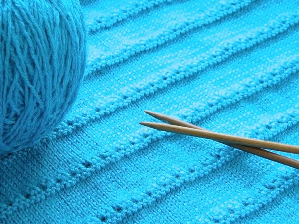 Openwork pattern with knitting needles — Stock Photo, Image