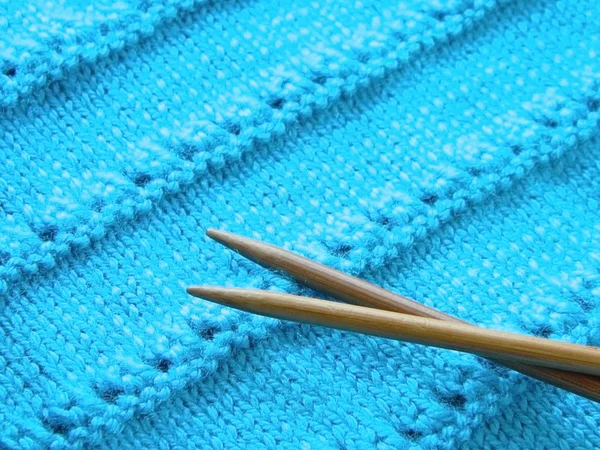 Openwork pattern with knitting needles — Stock Photo, Image