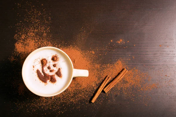 Cup of coffee with panda pattern of cinnamon — Stock Photo, Image