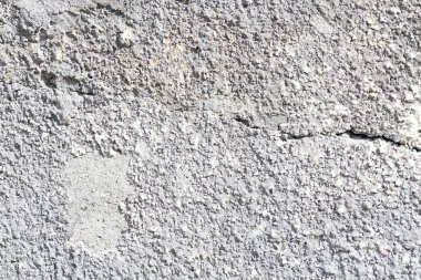 Beton duvar dokusu arka planı. Doğal taşlar. Binanın ön cephesi. Dekoratif alçı. Evin dışı..