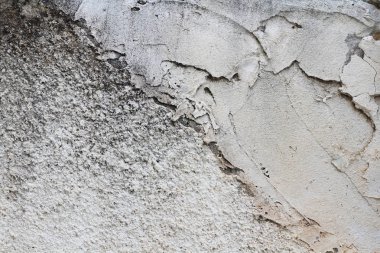 Beton duvar dokusu arka planı. Doğal taşlar. Binanın ön cephesi. Dekoratif alçı. Evin dışı..