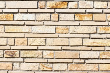 Beton duvar dokusu arka planı. Doğal taşlar. Binanın ön cephesi. Dekoratif alçı. Evin dışı..