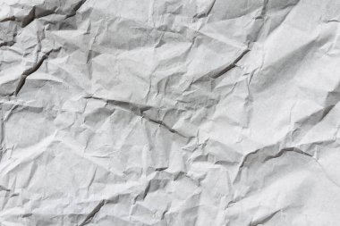 Buruşuk gri el işi kağıt dokusu arka planı. Paket ambalajı. Eski ambalaj kağıdı. Pişirme parşömeni. Harf şablonu.