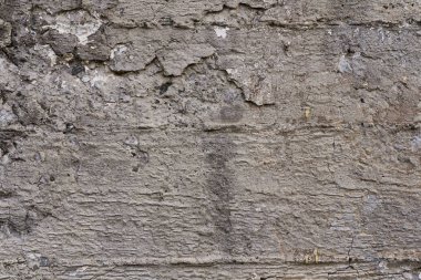 Beton duvar dokusu arka planı. Doğal taşlar. Binanın ön cephesi. Dekoratif alçı. Evin dışı..