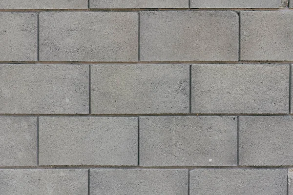 Beton duvar dokusu arka planı. Doğal taşlar. Binanın ön cephesi. Dekoratif alçı. Evin dışı..