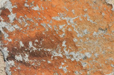 Beton duvar dokusu arka planı. Doğal taşlar. Binanın ön cephesi. Dekoratif alçı. Evin dışı..