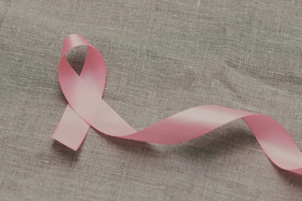 Pink ribbon. Symbol of breast cancer awareness. Health care conception. Preventive measures. October checking time. Women health. Text space.