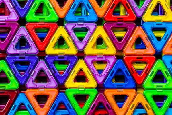 来自彩色三角形的背景 磁力构造器 彩色塑料三角形的图案 — 图库照片