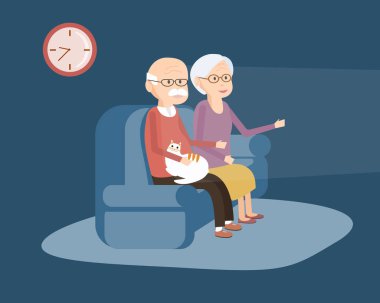 Kanepede oturan ve Tv izlerken yaşlı çift