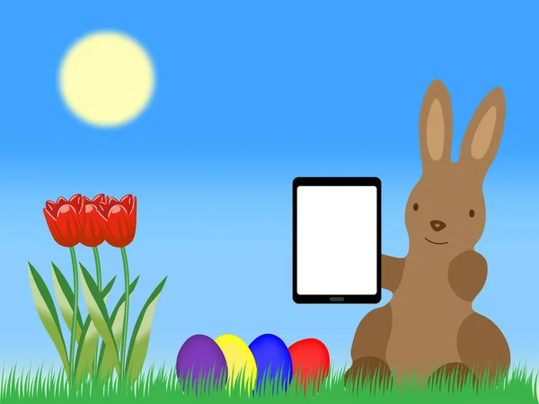 Kelinci Paskah dengan Tablet Computer Easter Eggs dan tulip di rumput — Stok Foto