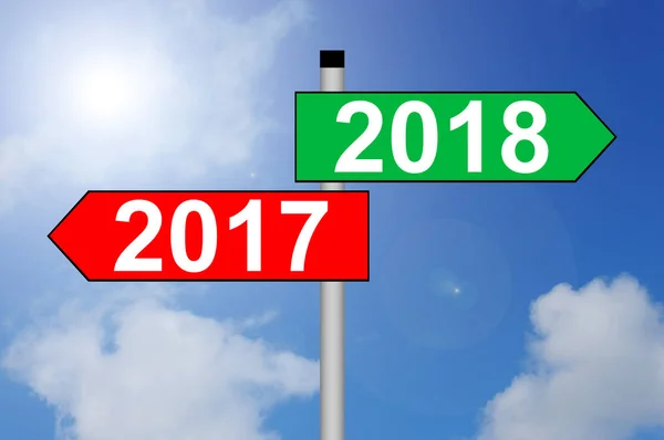 Turn of the year 2017 to 2018 Direction Sign with sky background