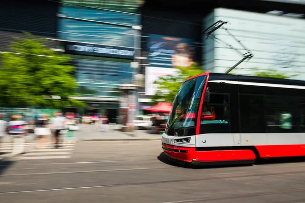 Modern tram blurred in motion in the Prague city, Europe