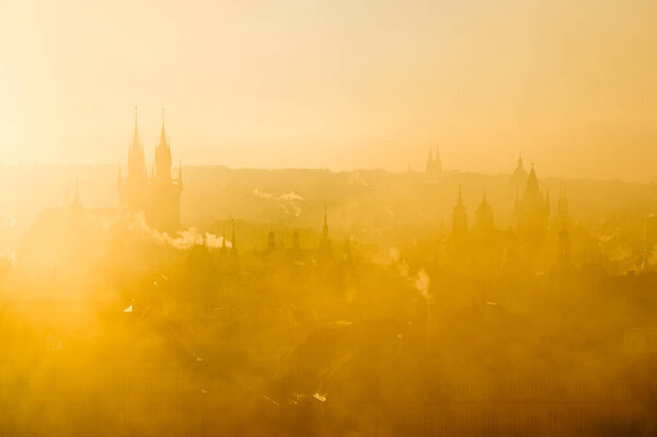 Beautiful godlen scenery of soft Prague morning misty cityscape
