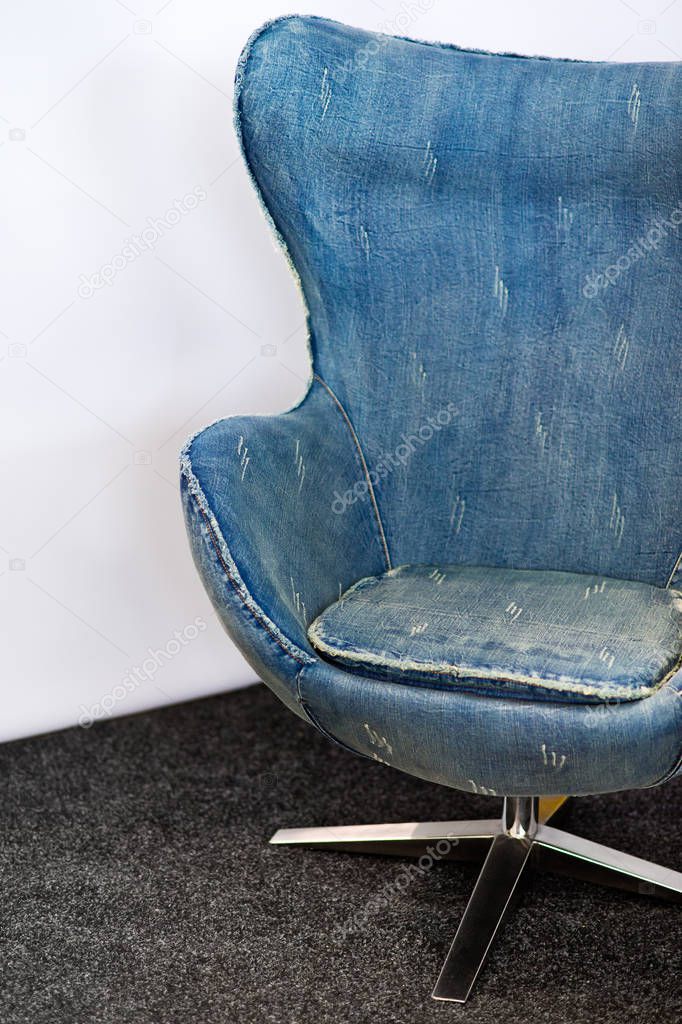 Famous egg chair, originally designed by Arne Jacobsen, in blue jeans color