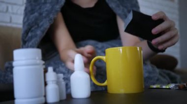 Medicine powder falling down in glass with water. Flu Medicine Powder Dissolving in Water. Powdered medicine pouring into an empty drinking glass and filling with boiling water.