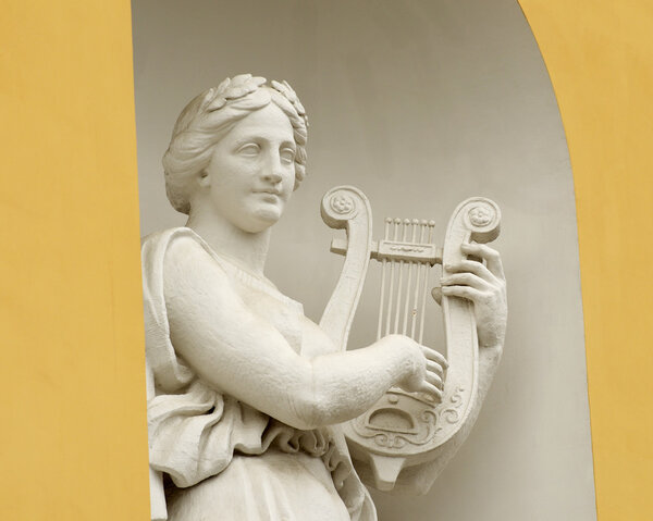 Sculpture of woman with lyre.