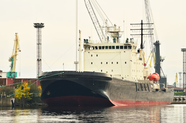 The icebreaker is moored to the pier.