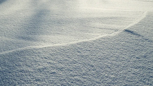 Η υφή του χιονιού το φως. — Φωτογραφία Αρχείου