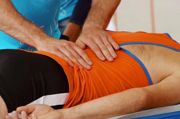 Sports massage therapists work. — Stock Photo, Image