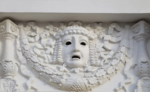 Plaster mask on the wall of the theater. — Stock Photo, Image