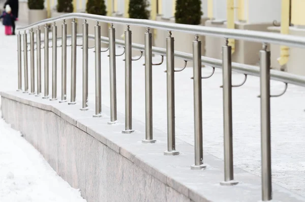 Metal railings for pedestrians.